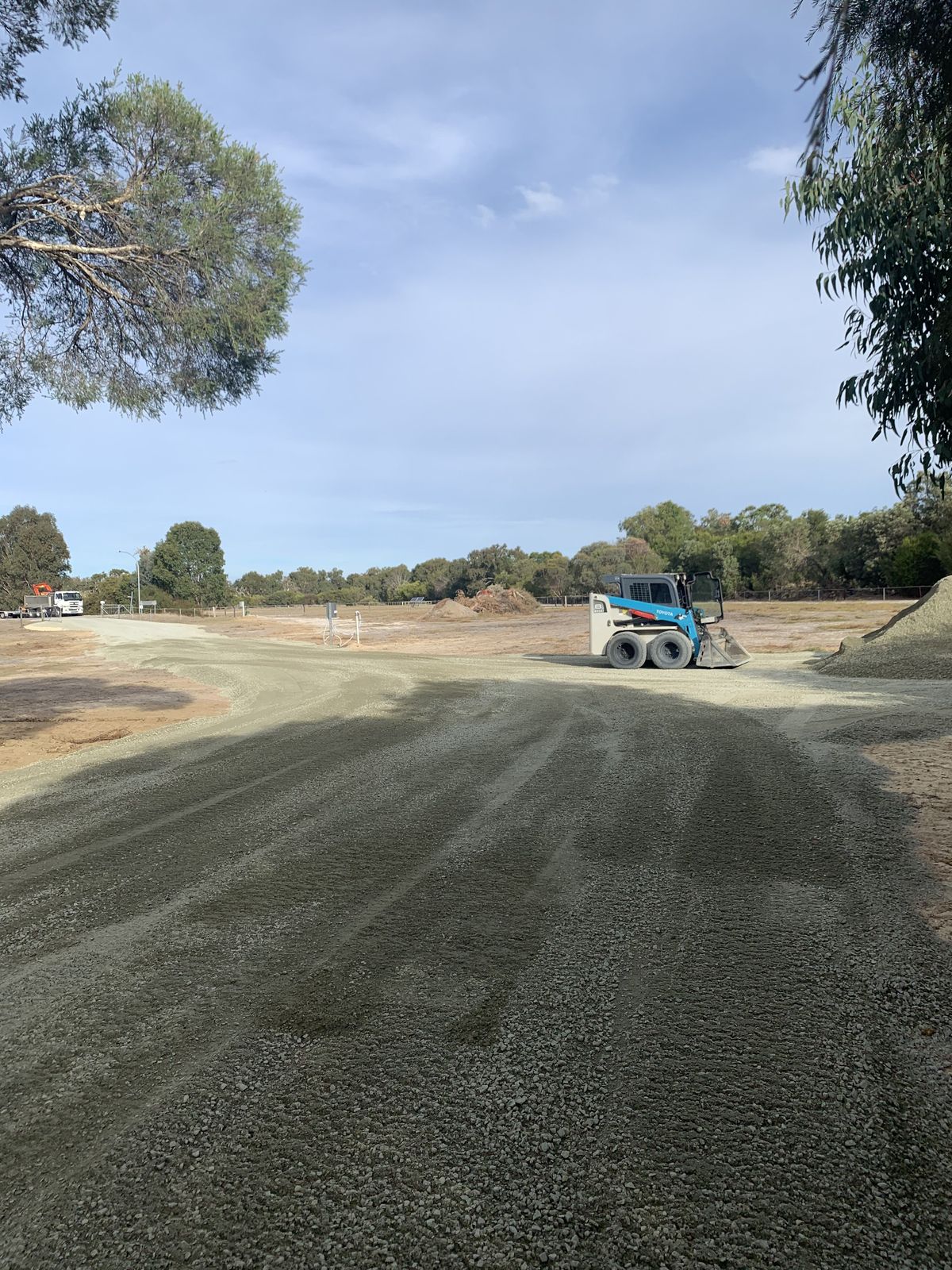 Professional driveway preparation with gravel compaction using bobcat in Mandurah, Western Australia
